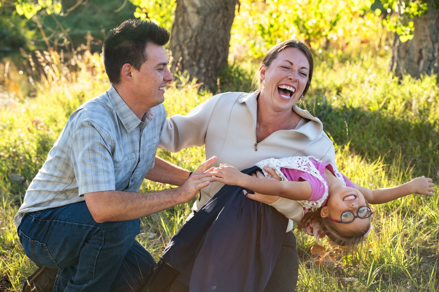 Flopping child, laughing parents.