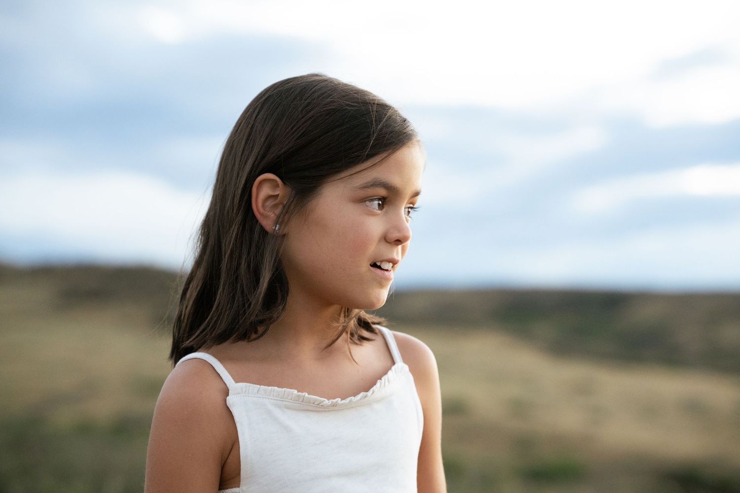 Daughter looking at sunset.