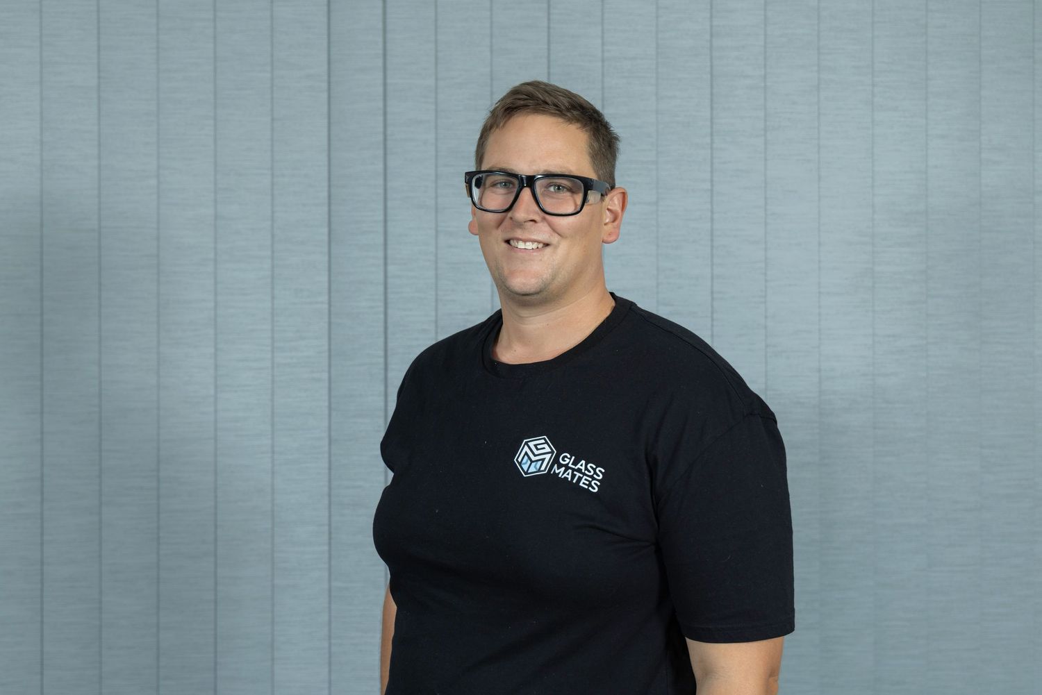 Jack Weaver Founder of Glass mates. Shot in his office with blinds as background for website headshot.