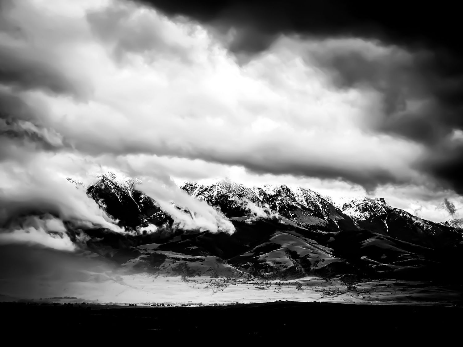 Black and white dramatic snow-capped mountain peaks shrouded in storm clouds. Monochrome Southern Landscapes
Outdoor Photography