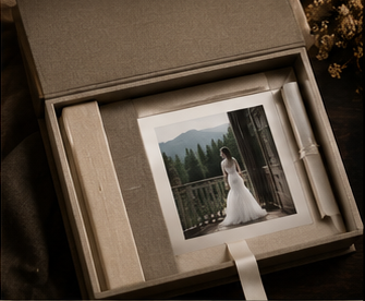 Wedding portrait of a bride on a mountain balcony displayed in a linen keepsake box with ribbon.