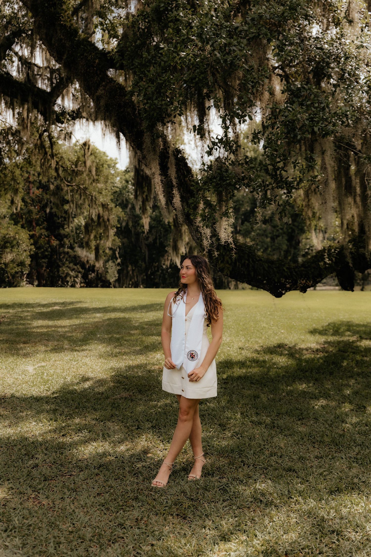 Graduation pictures under oak tree in Orlando botanical garden
