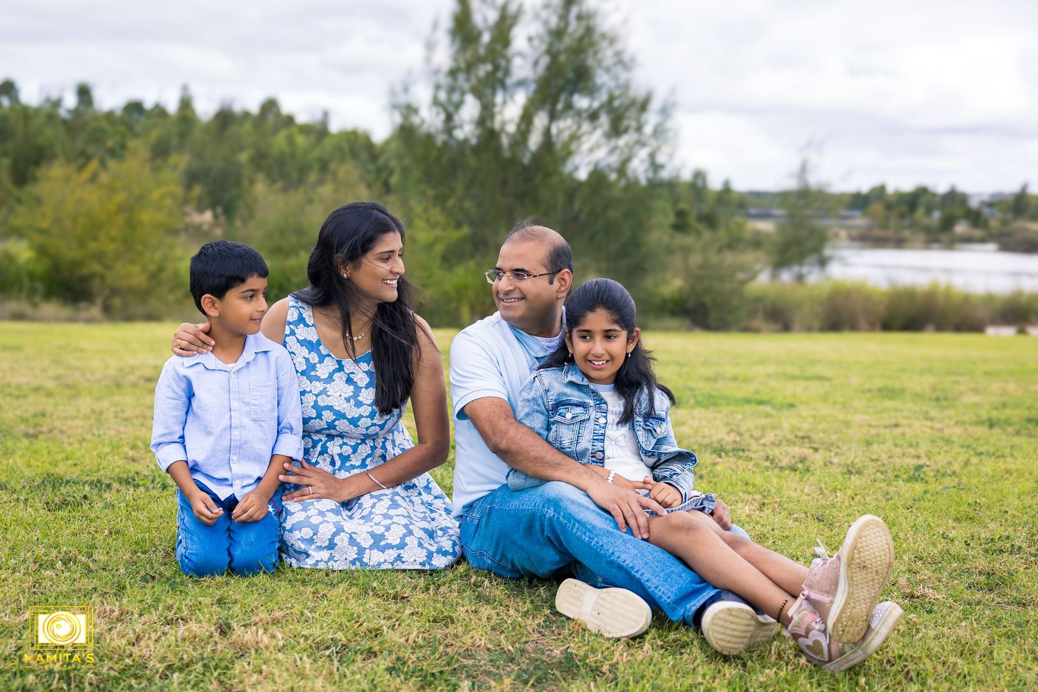 Family laughing together during relaxed lifestyle photography session