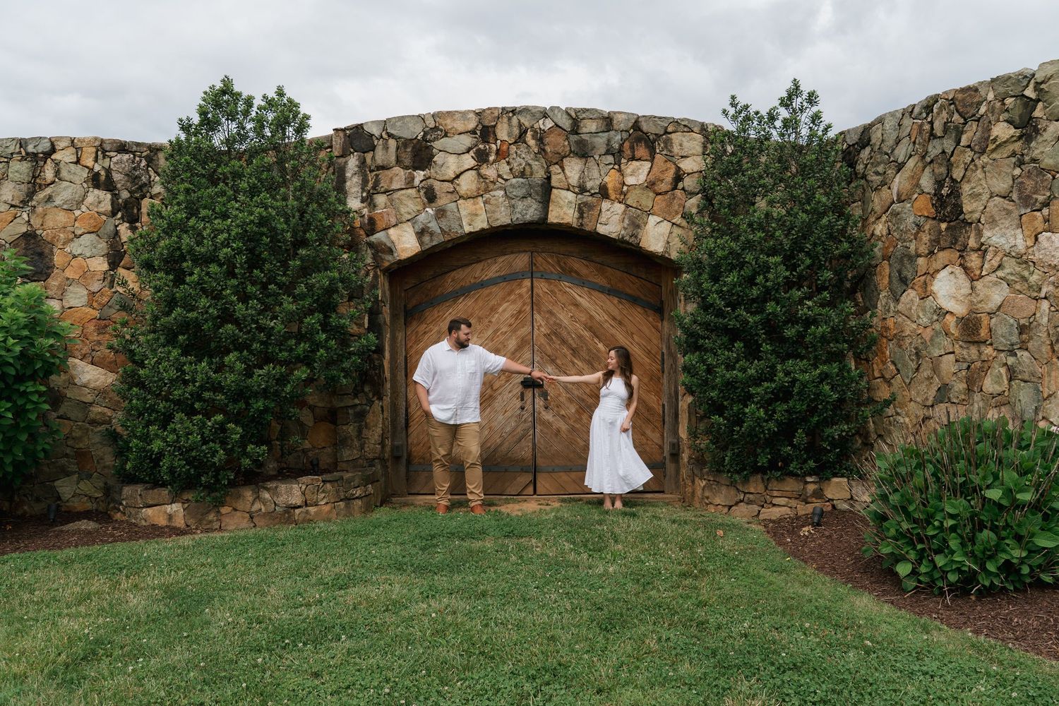 Engagemnt photo of couple holding hands at Stone Tower Winery in Leesburg, Virginia