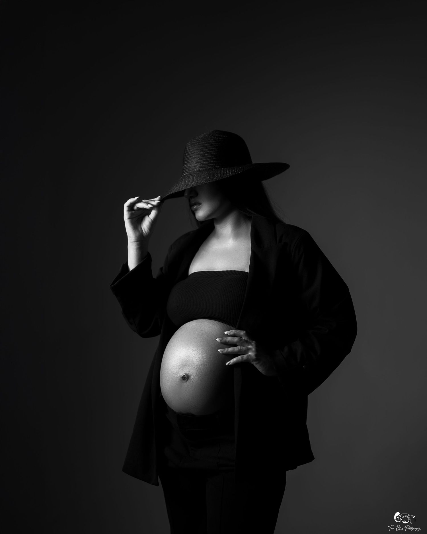 Black and white artistic nude photography series showing silhouettes and shadows against dark backgrounds.