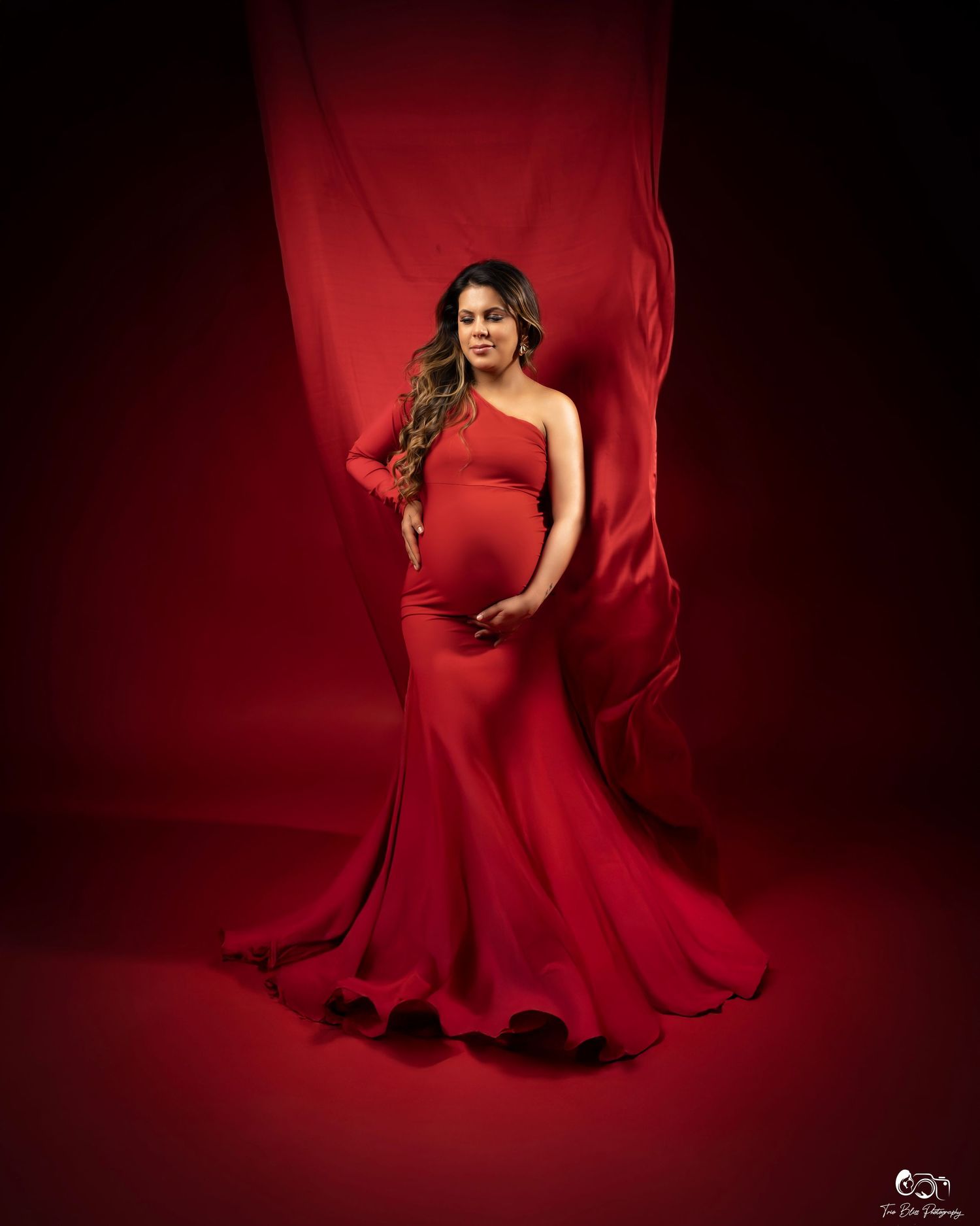 Dynamic series of red fabric motion captures against dark background showing flowing movement and dramatic shadows.