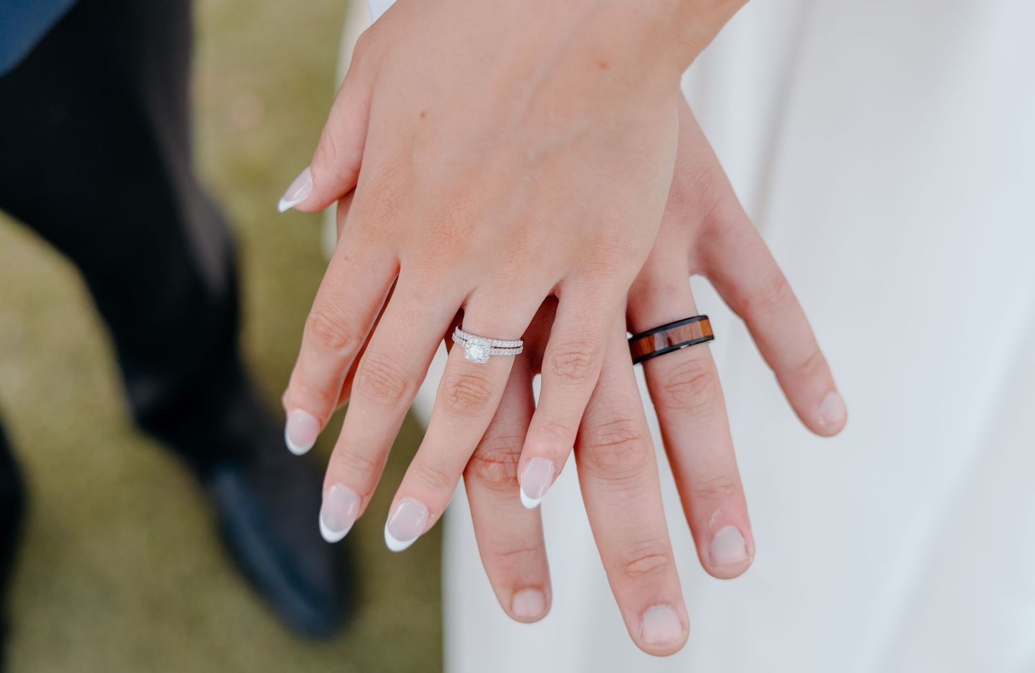 Close-up series of hands wearing wedding rings against a light background.