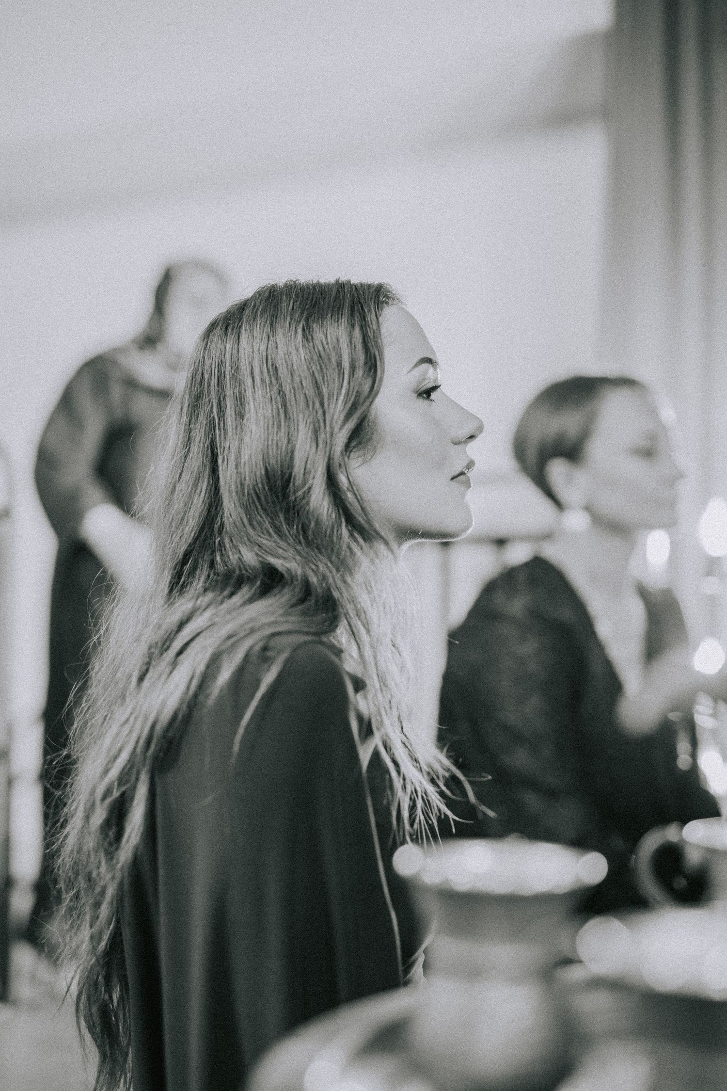 Black and white profile portrait of guest during elegant evening celebration.
