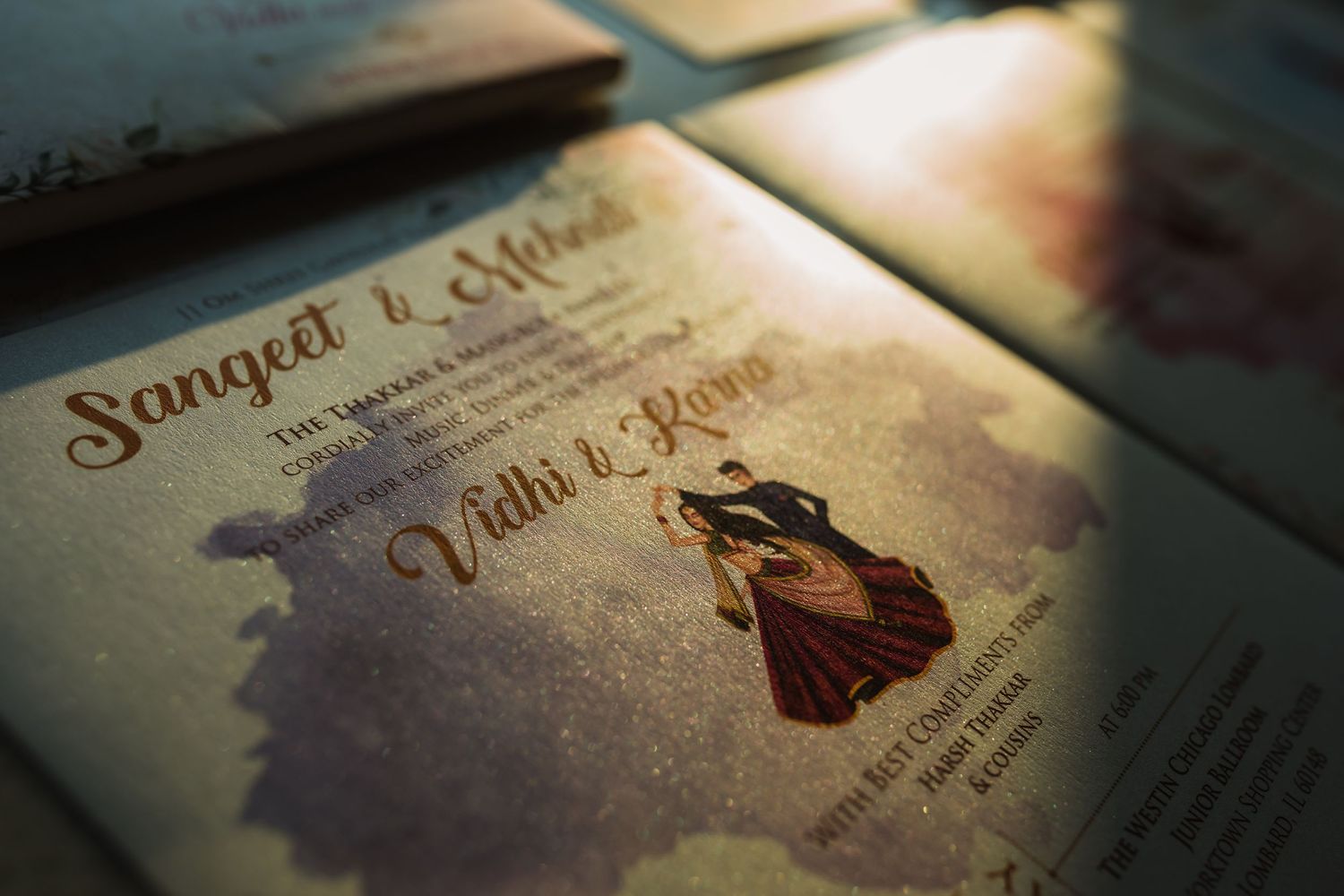 Closeup of an elegantly designed traditional Indian wedding invitation card in vintage style.