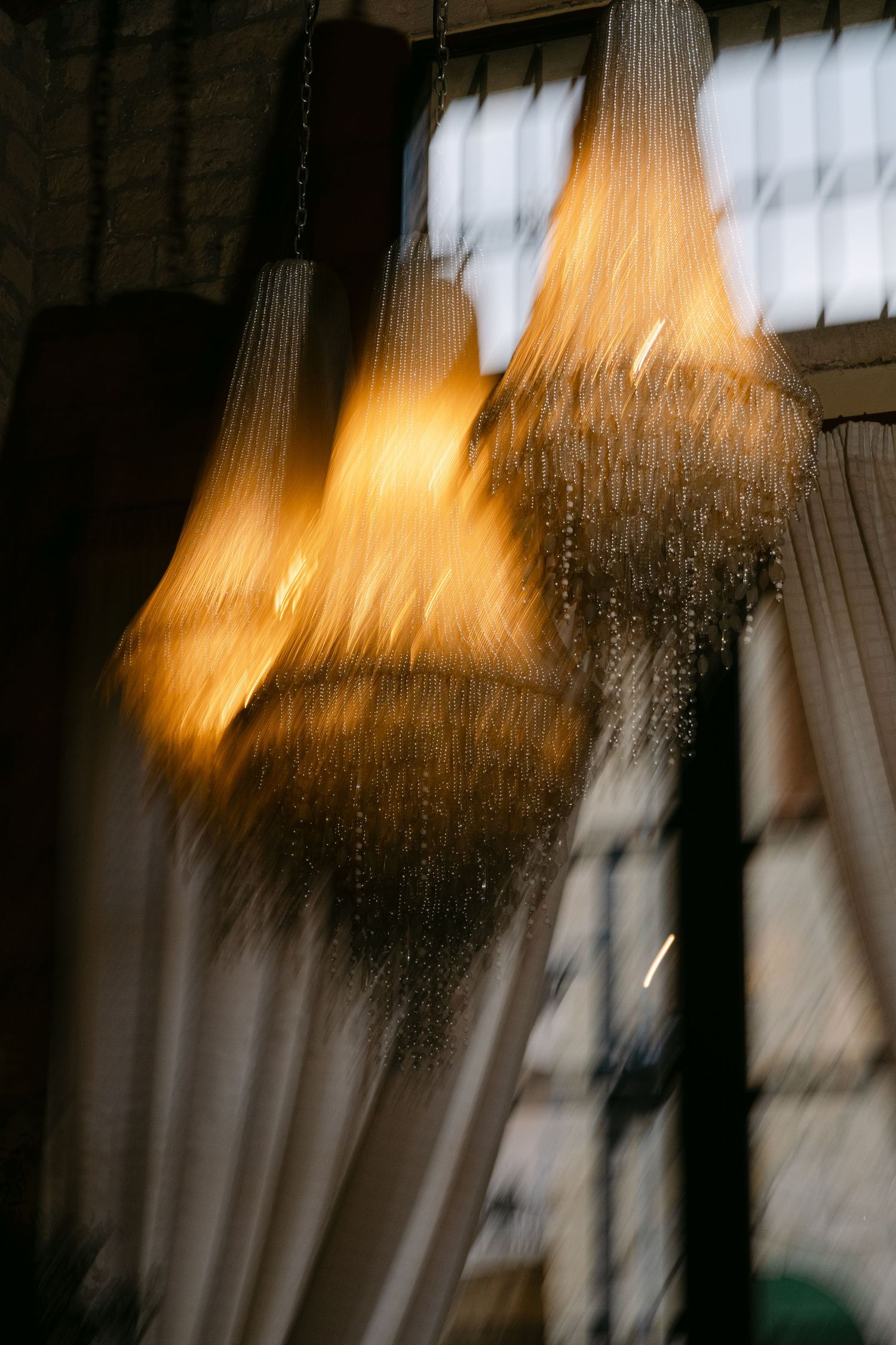 Artistic motion blur sequence shows abstract light movement getting progressively more distorted across multiple frames.