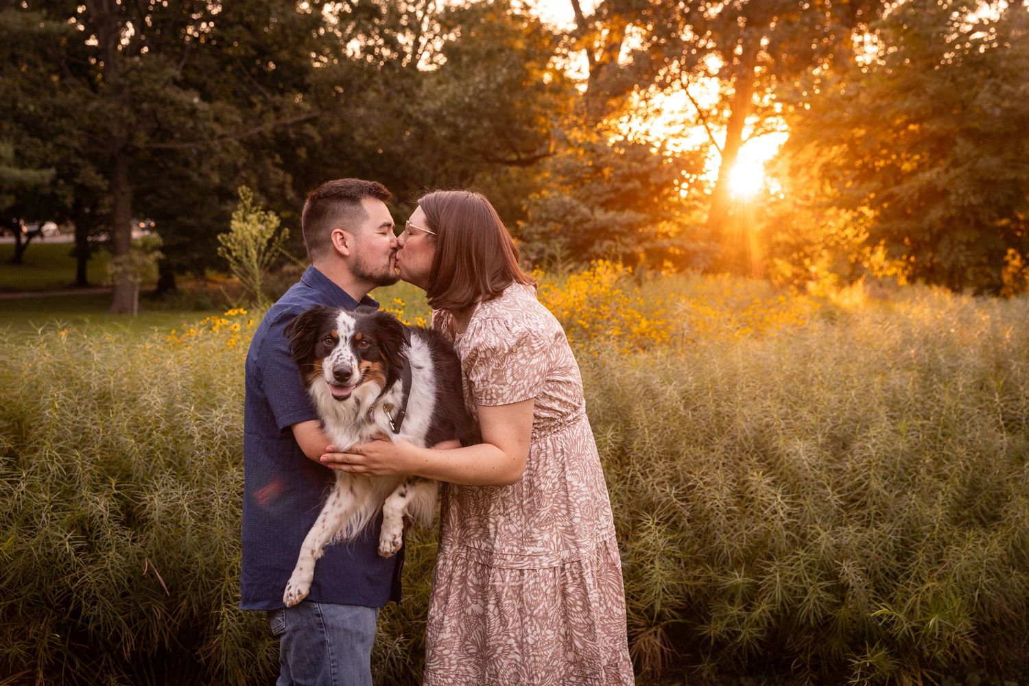 Romantic silhouettes of a couple share tender moments in a golden field at sunset.