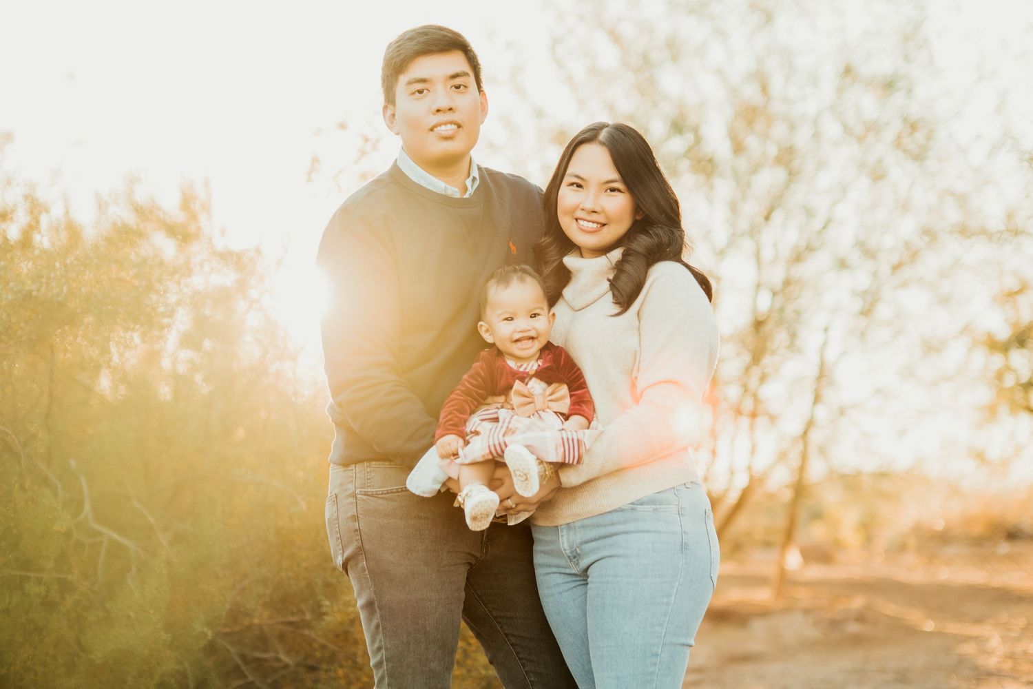 Family portrait at sunset in desert landscape.