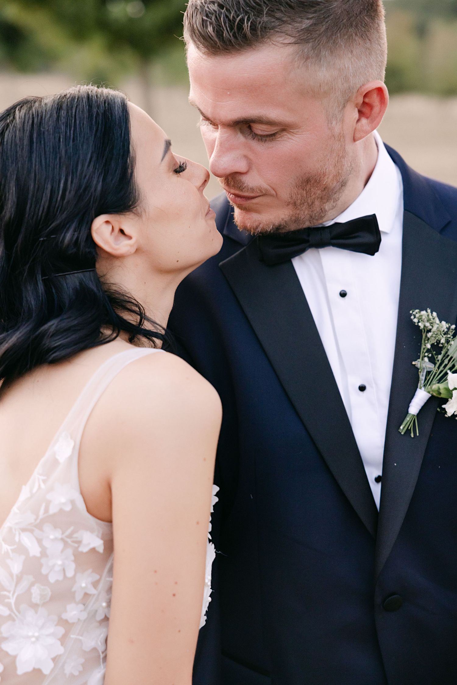 Romantic wedding photo series showing intimate closeup moments between bride and groom sharing tender kisses.