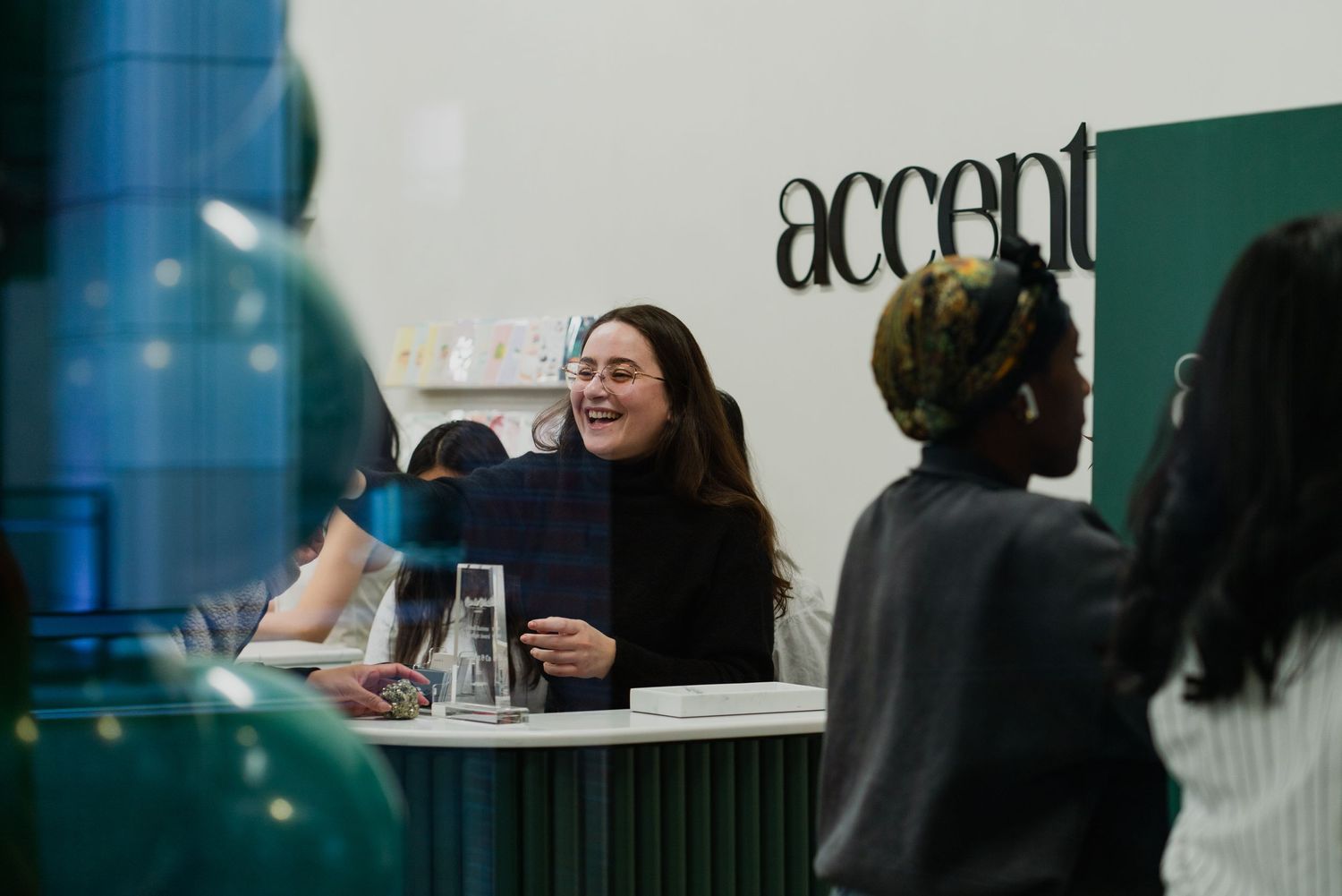 Business networking event with Accent & Co branding visible in the background.