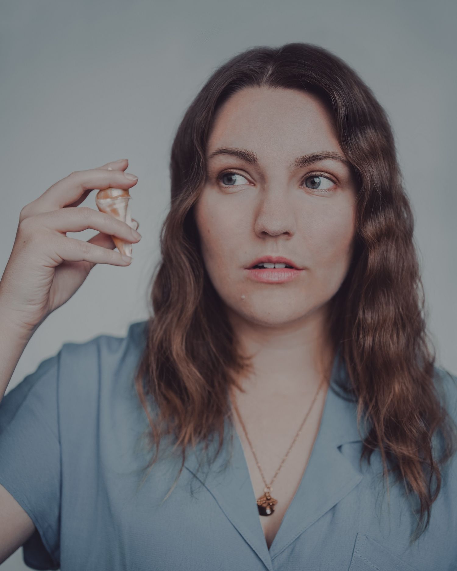 A portrait series showing expressive hand gestures against a light blue background.