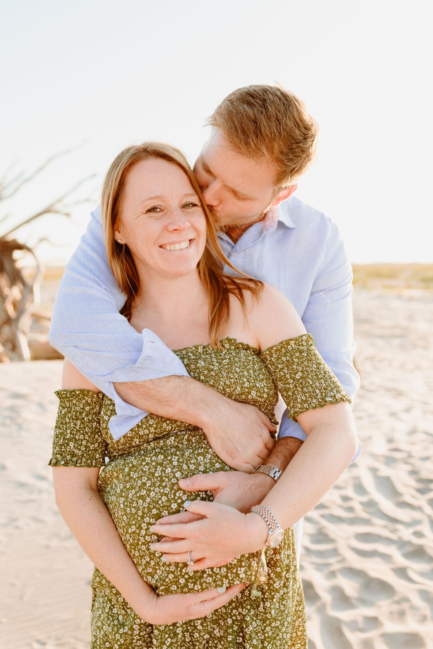 A couple shares an intimate moment on the beach at sunset. Charleston, South Carolina. Salt and Oak Photography.