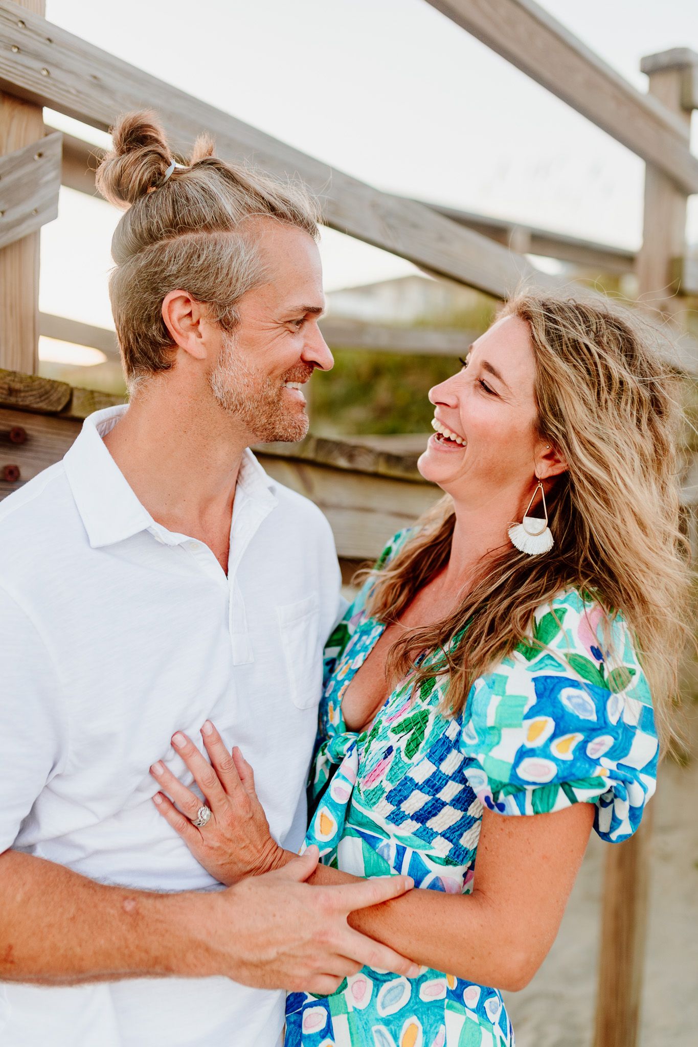 A happy couple shares a candid moment of laughter. Charleston, South Carolina. Salt and Oak Photography.