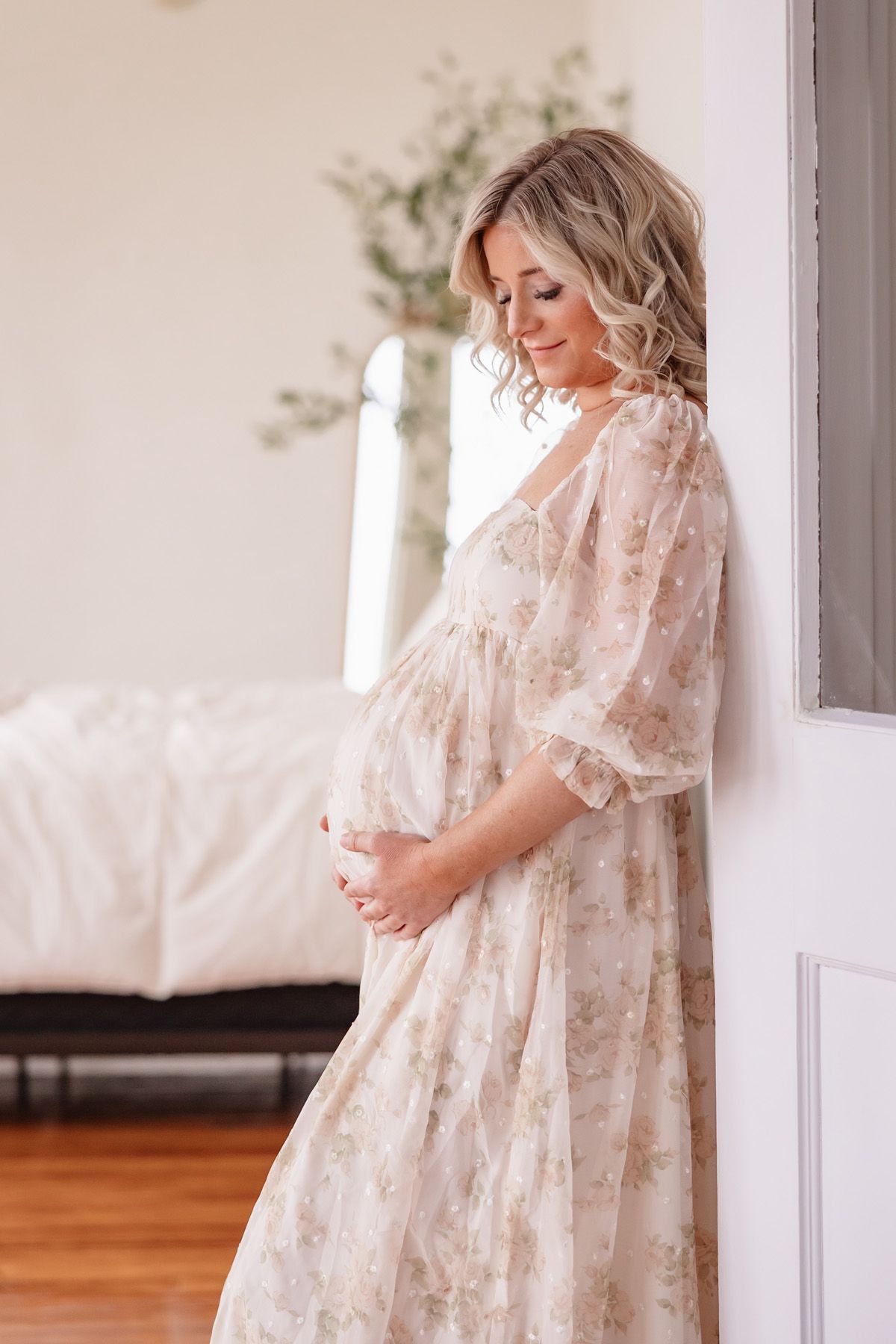 Soon-to-be mom photographed in the beautiful natural light studio of Courtney Morehead Photography in downtown Ada, OK