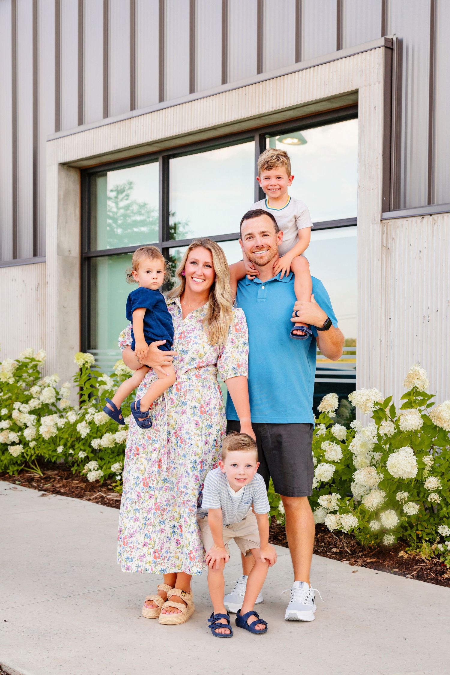 Family portrait session outside a modern building in Wheeler District, OKC
