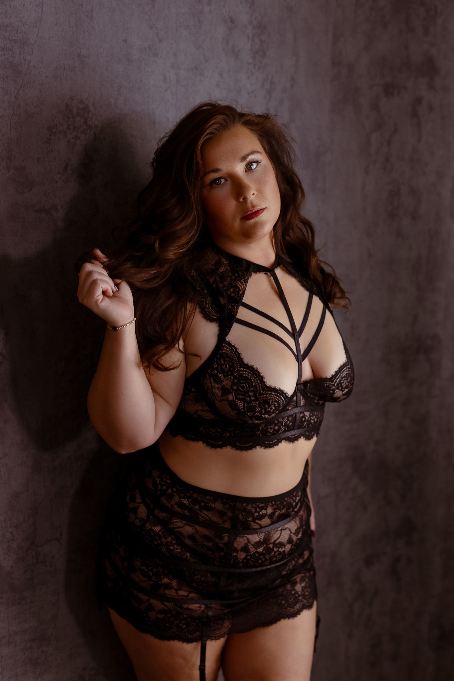 Woman in black lingerie set posing confidently during a boudoir session at LD Photography in Maryland.