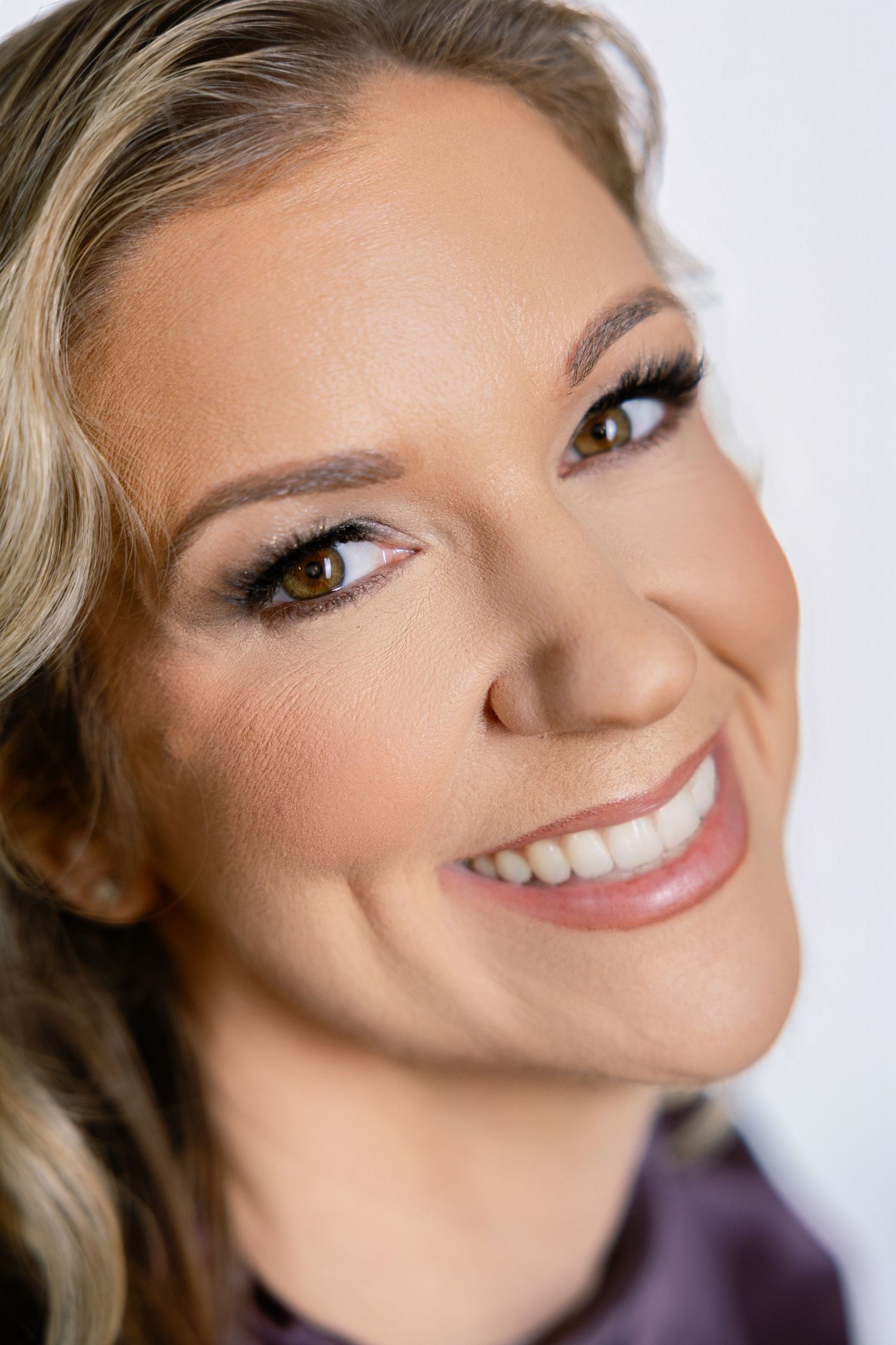 Professional beauty portrait series showing close-up shots with soft lighting and glowing makeup looks.