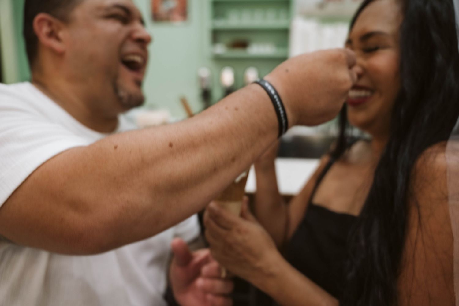 A series of five candid photos showing people laughing and embracing during joyful moments together.