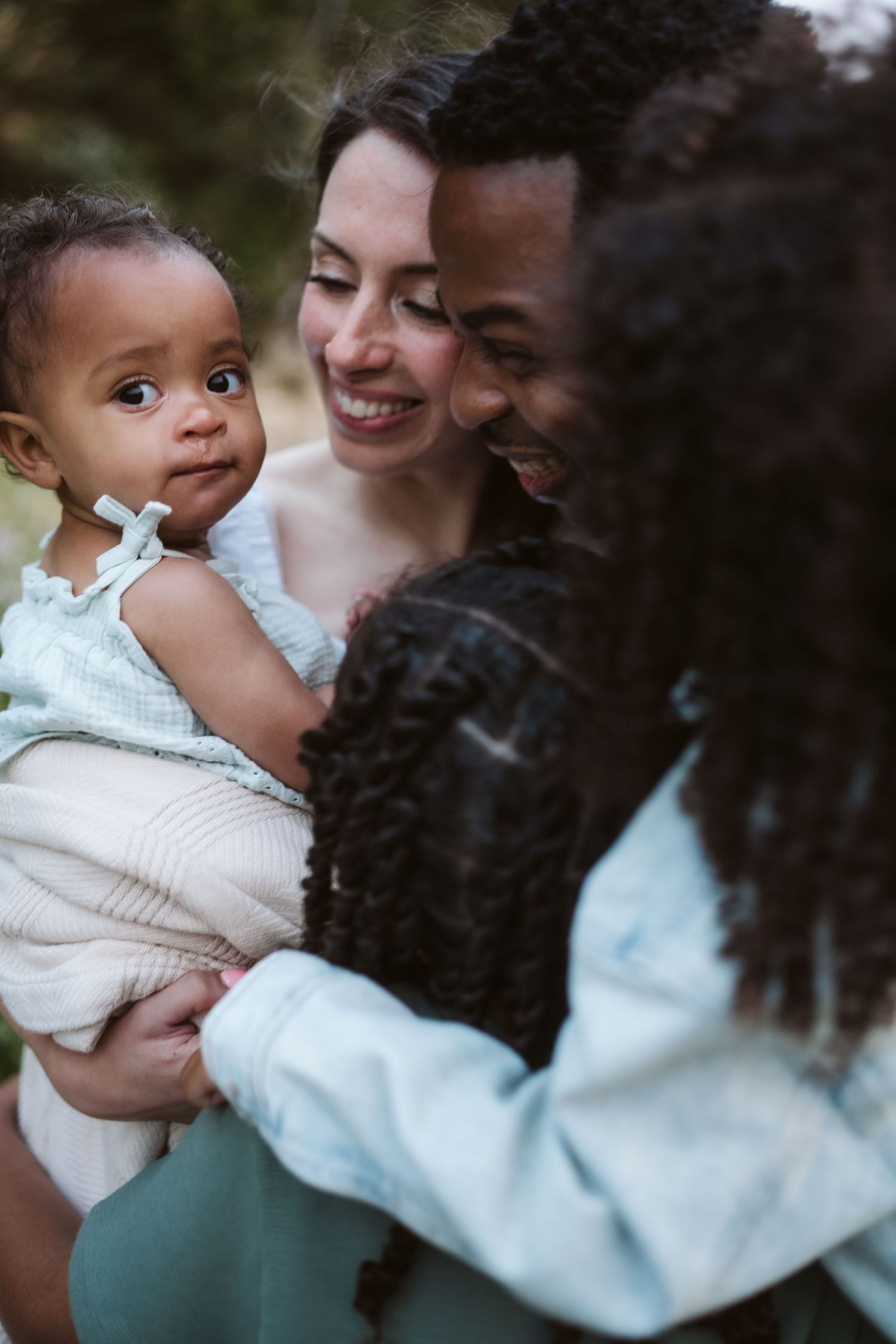 A tender family moment captured in a series of intimate photographs showing parent and child bonding together.