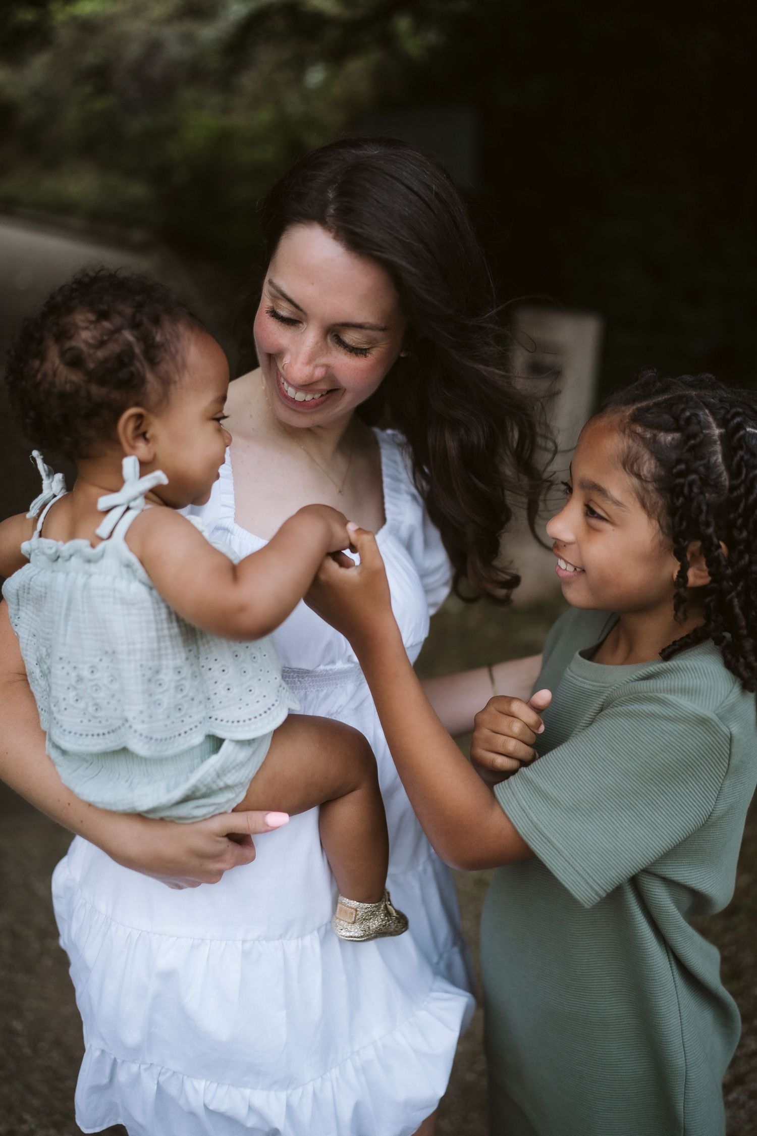 A playful sequence of candid family moments captured outdoors showing joyful interaction and laughter.