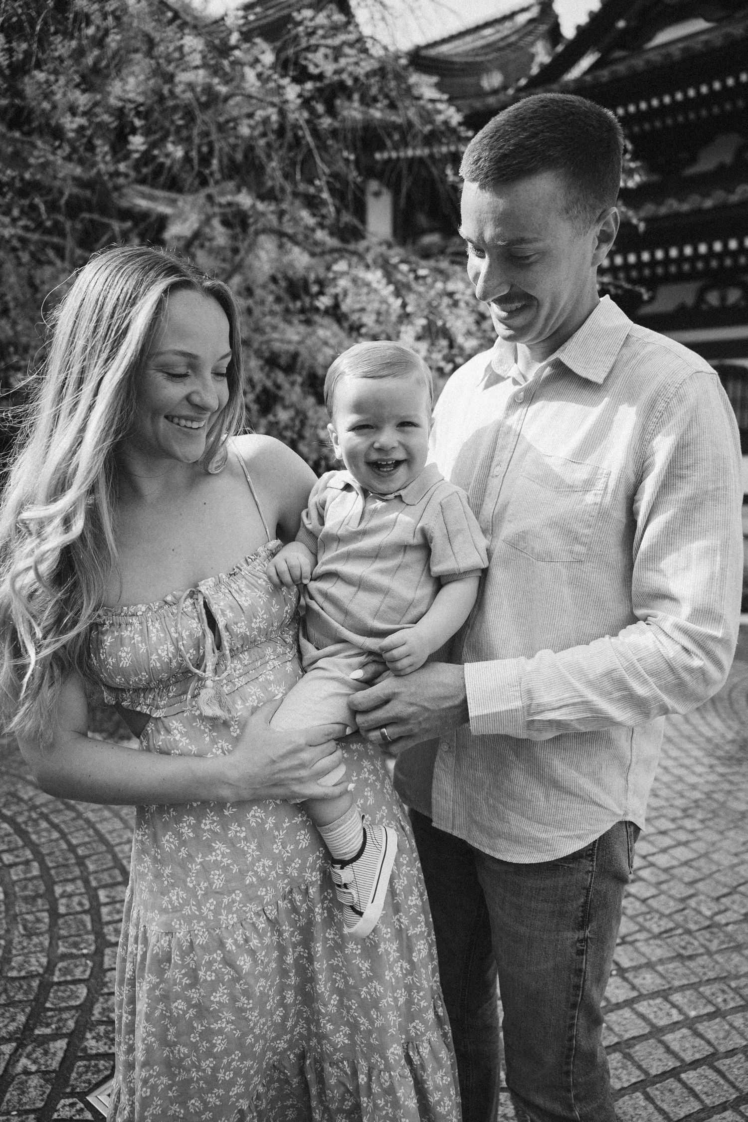 A candid sequence of joyful family moments captured outdoors showing natural interactions and laughter on a stone path.