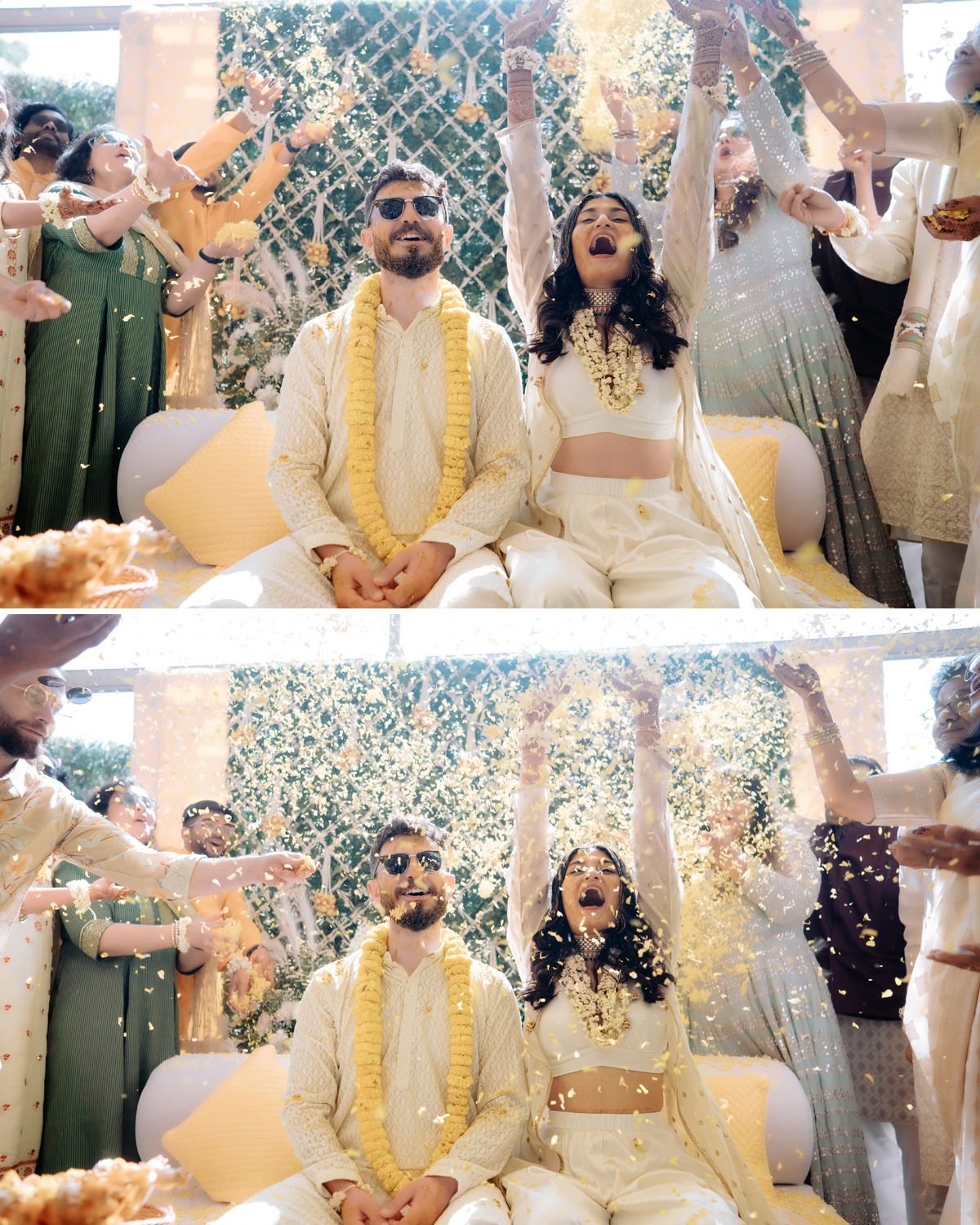 A couple sits during their wedding ceremony while guests throw yellow flower petals in celebration.