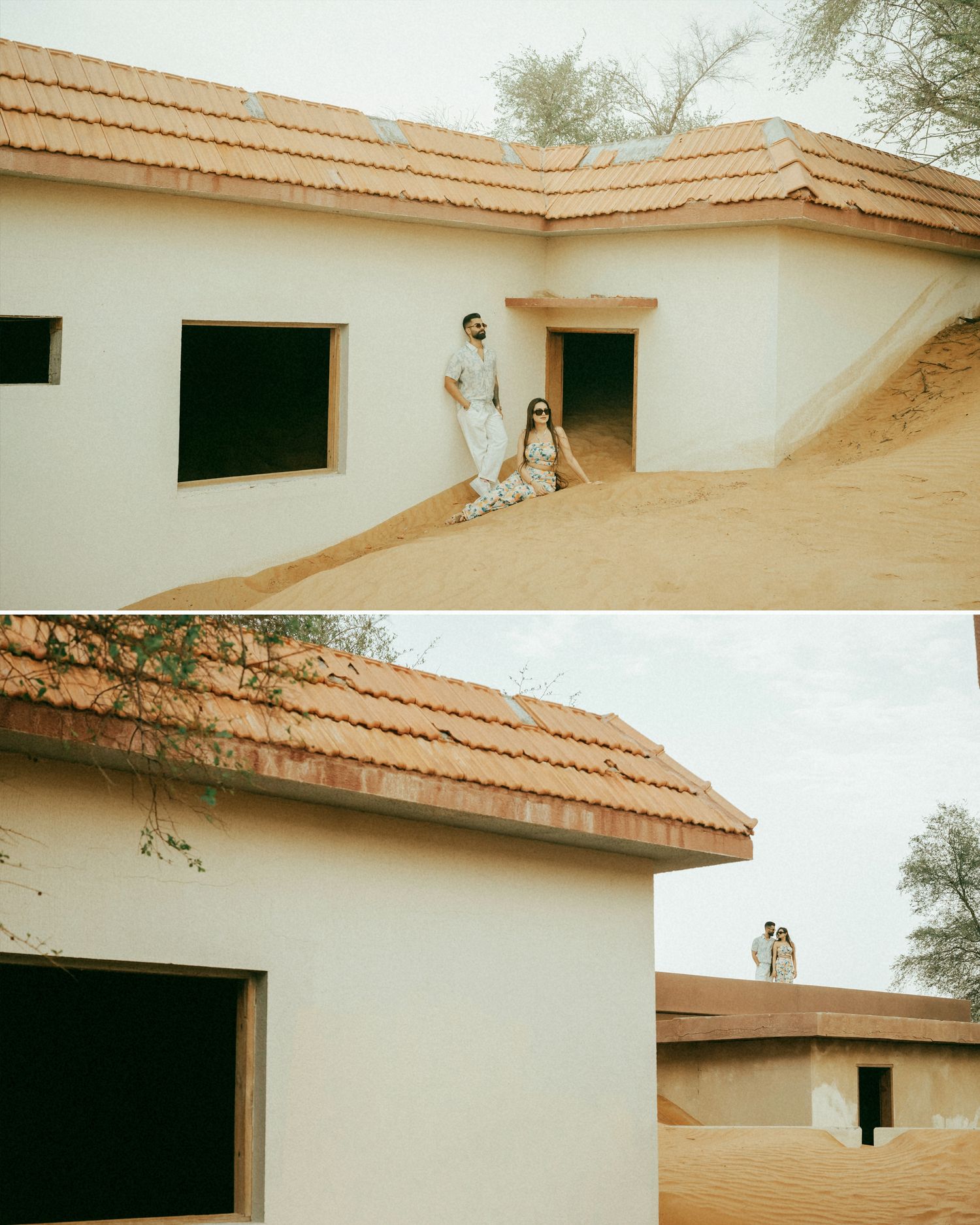 Couple posing on a white desert building with terracotta roof tiles surrounded by sandy landscape.