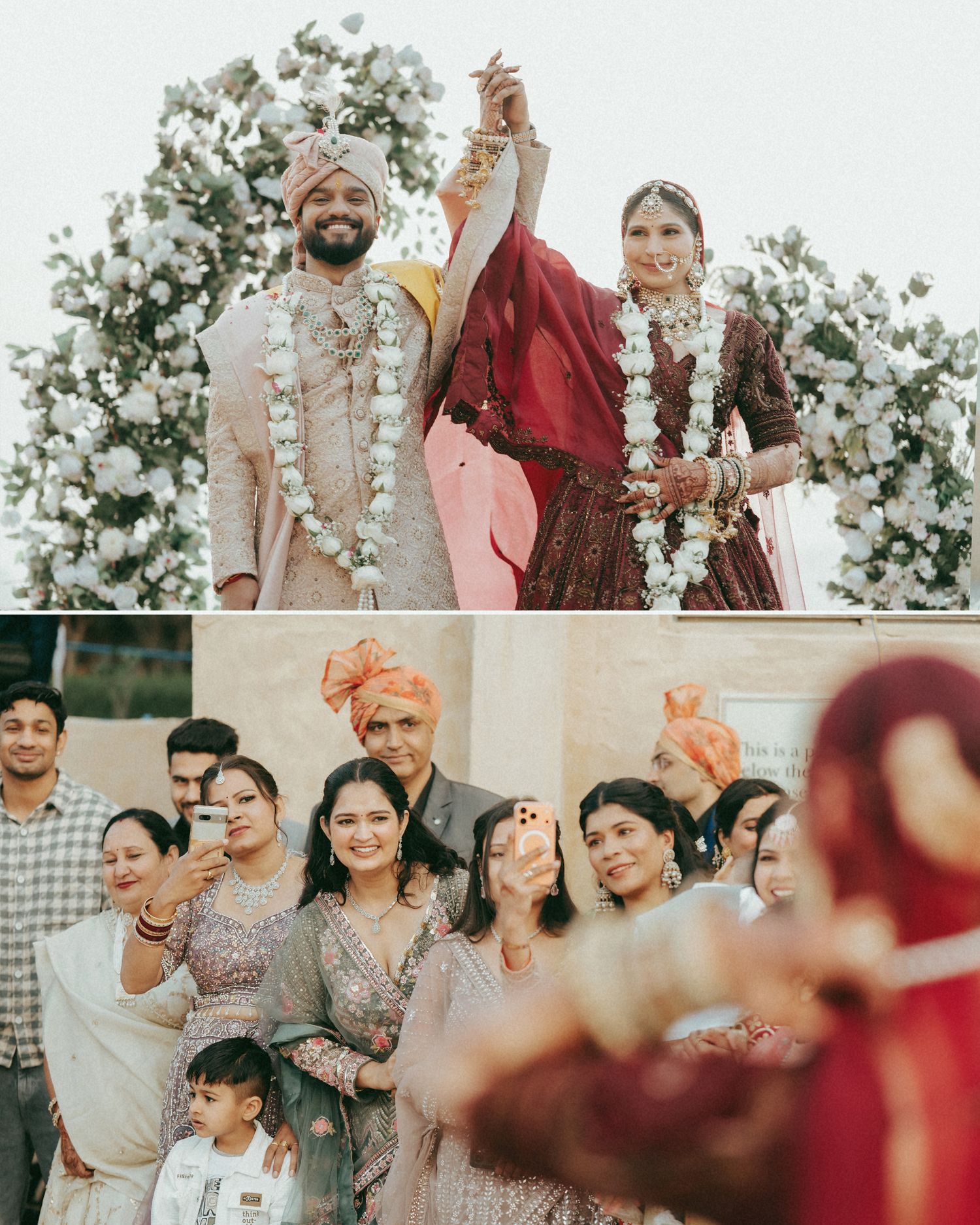 Indian wedding couple in traditional attire holding hands at floral altar, with guests taking selfies below.