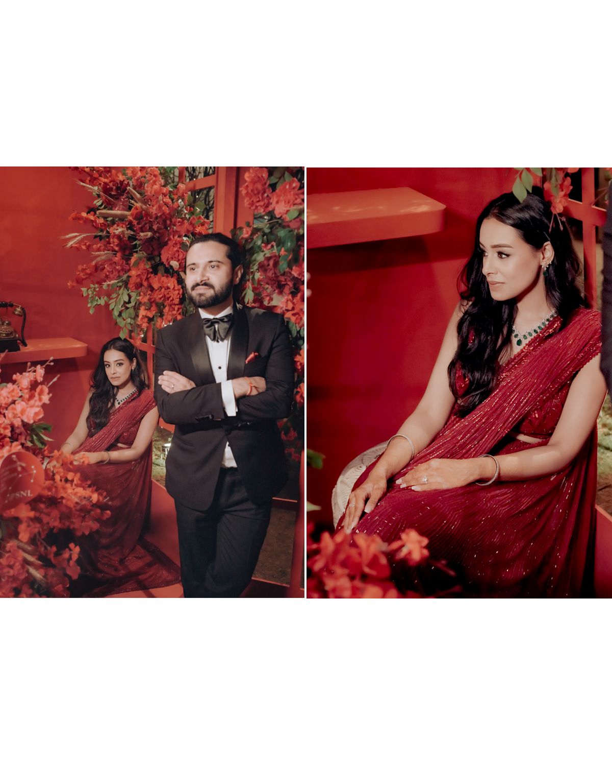 A couple in formal attire poses together against a vibrant red backdrop with floral decorations at an elegant event.