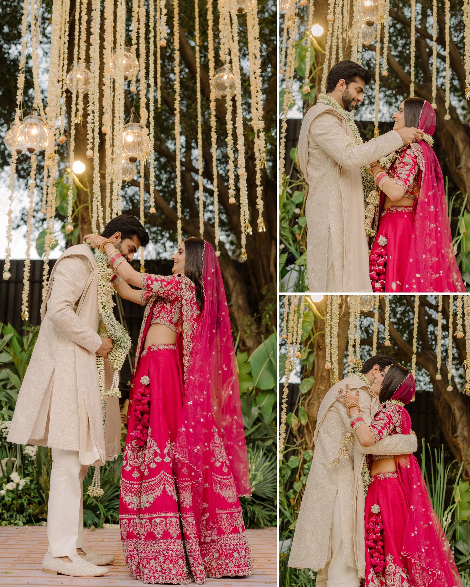 Indian bride in pink lehenga and groom in cream sherwani exchange garlands at floral wedding ceremony.