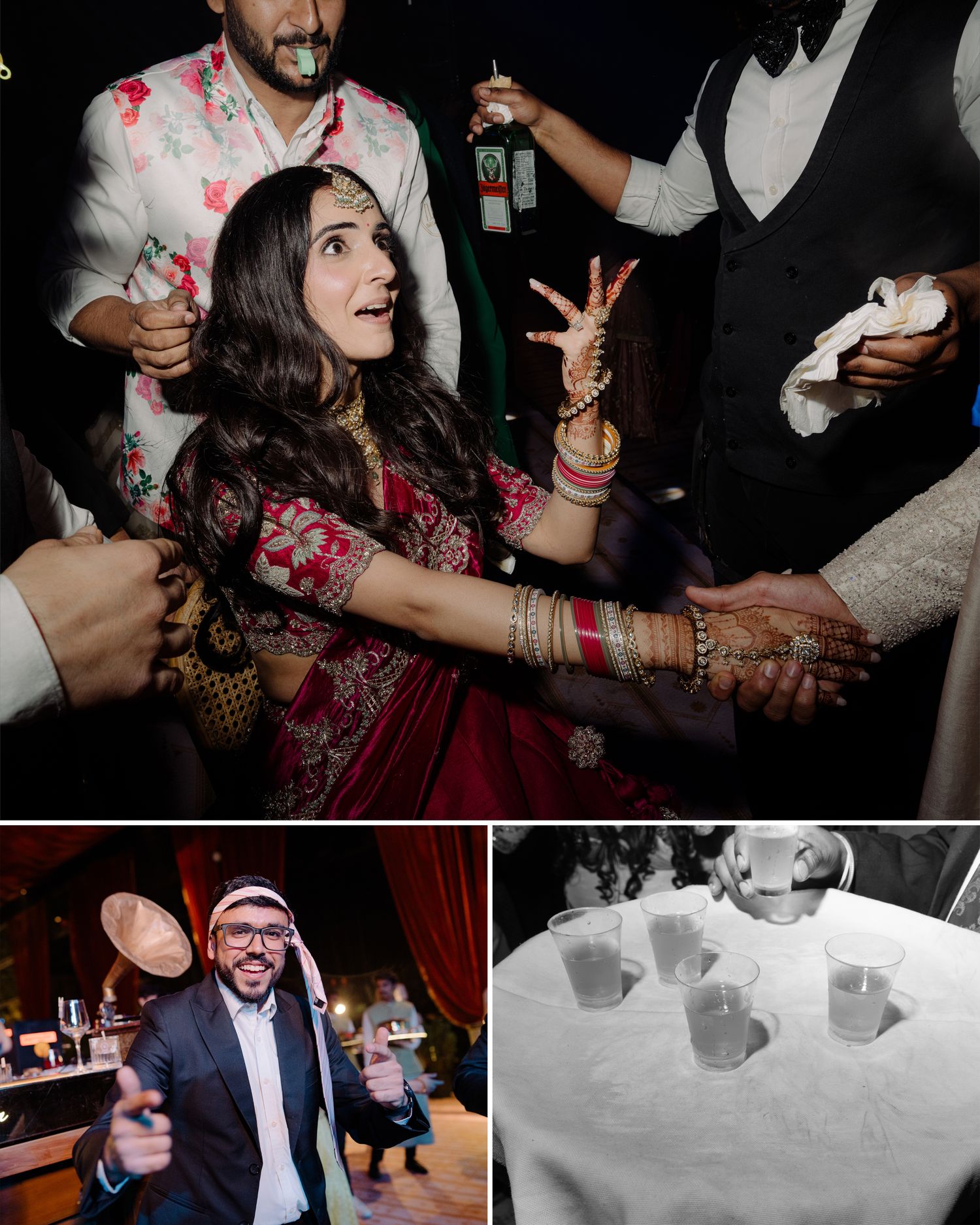 Indian bride in red lehenga with henna hands celebrates at wedding reception party with guests dancing around her.