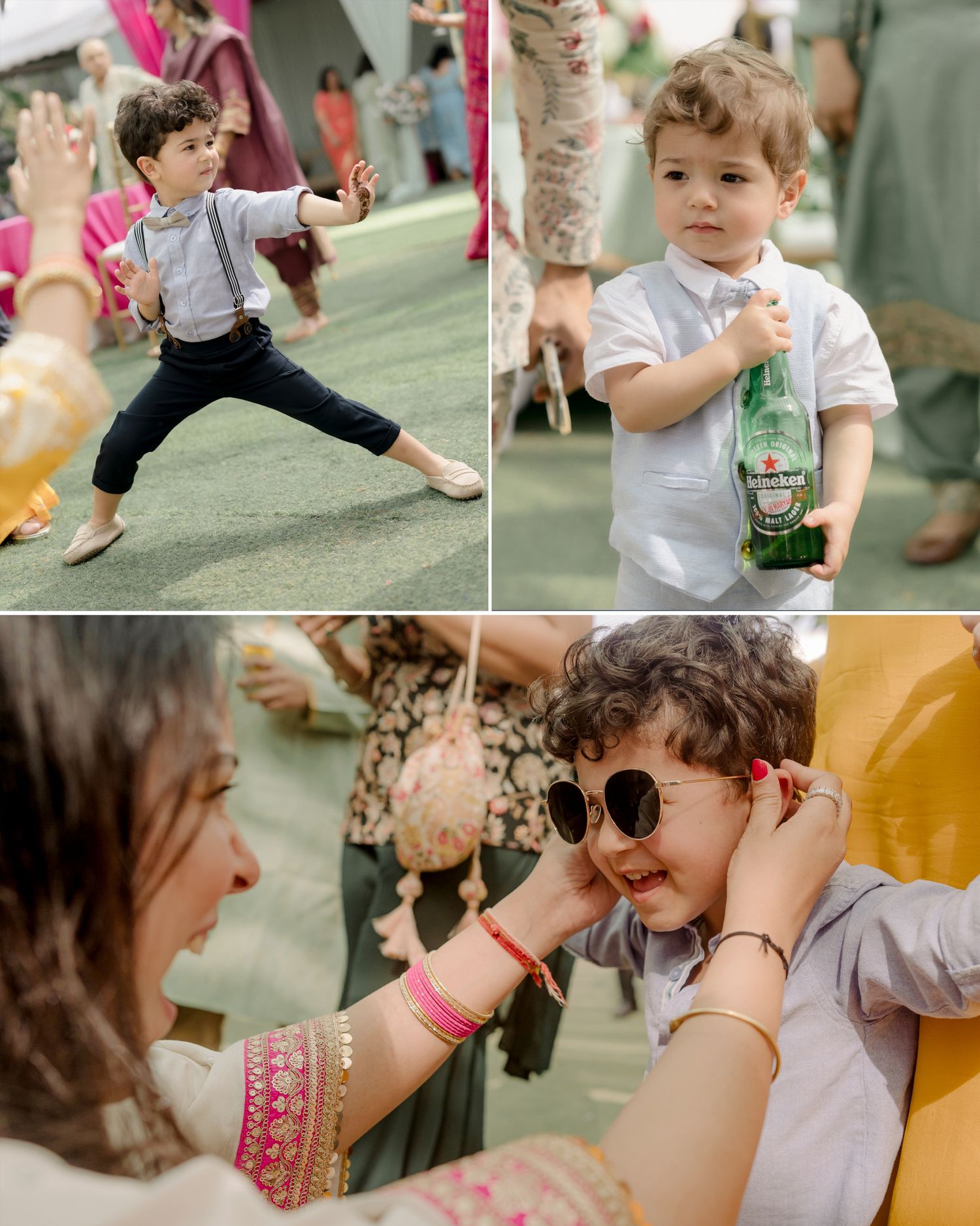 Toddler boy in white shirt and suspenders dancing at a wedding, holding a Heineken bottle, while a woman puts sunglasses on him.
