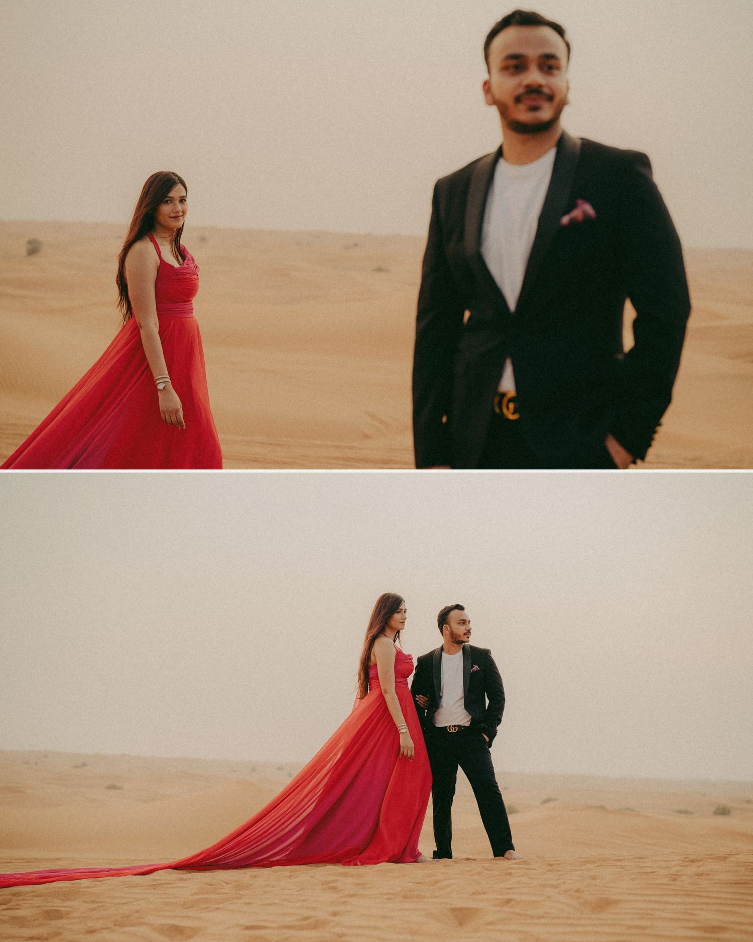 Couple posing in desert, woman in red flowing gown and man in black suit, sandy dunes backdrop.