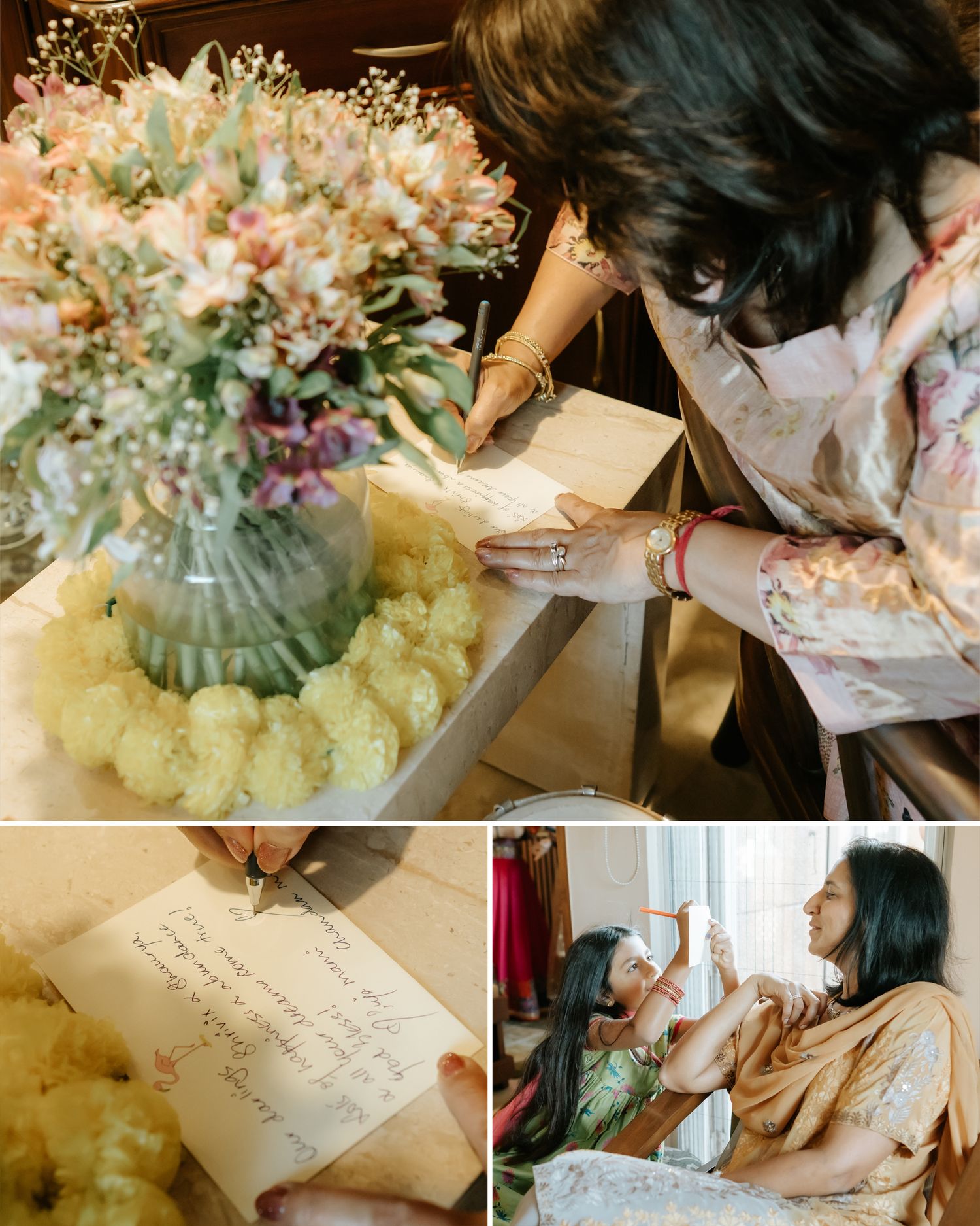 Woman writing a heartfelt note beside a pastel floral arrangement, with a child being dressed in traditional attire nearby.