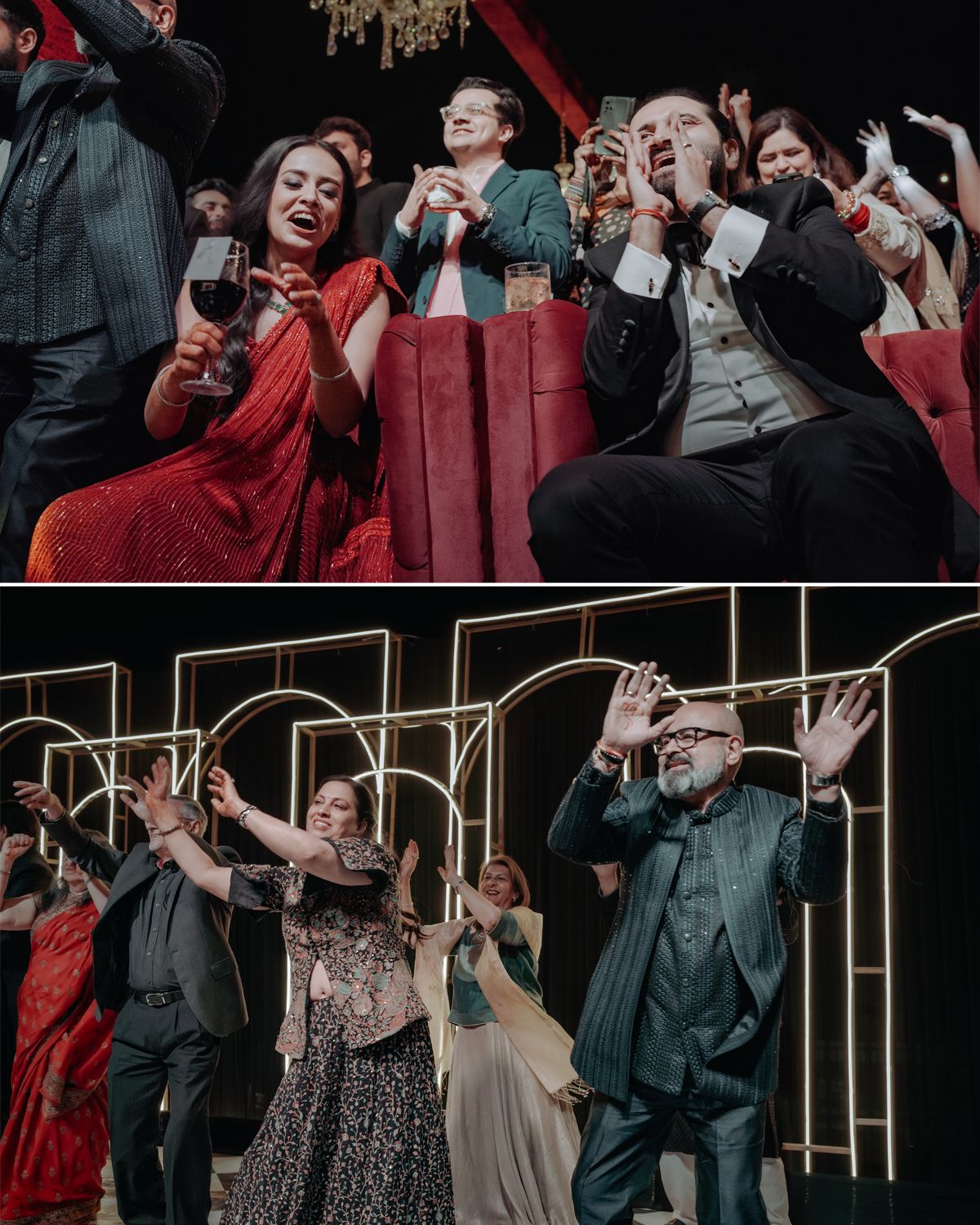 Wedding guests in formal attire laughing and holding wine glasses in a theater-style venue during a celebration.
