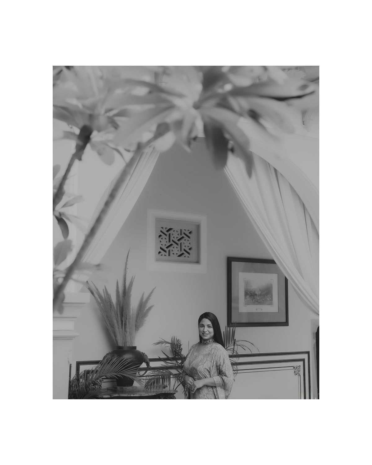 Black and white interior photograph showcasing architectural details under an arched ceiling.