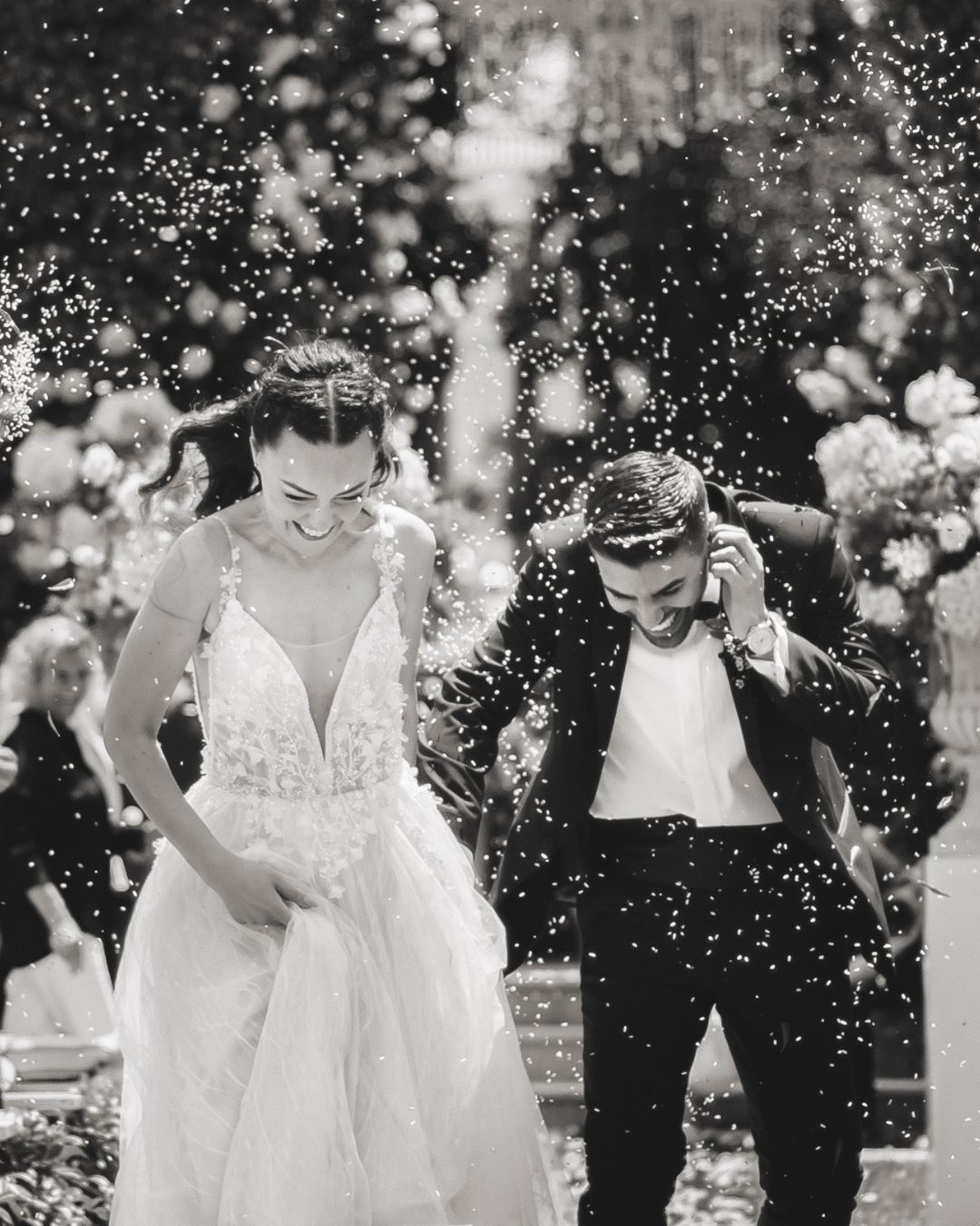 Emotional bride and groom moment captured in the gardens of a Tuscan estate.