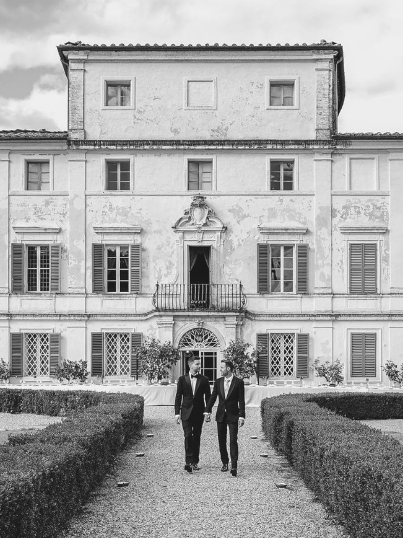 Emotional portrait of two grooms during a destination wedding in Puglia.