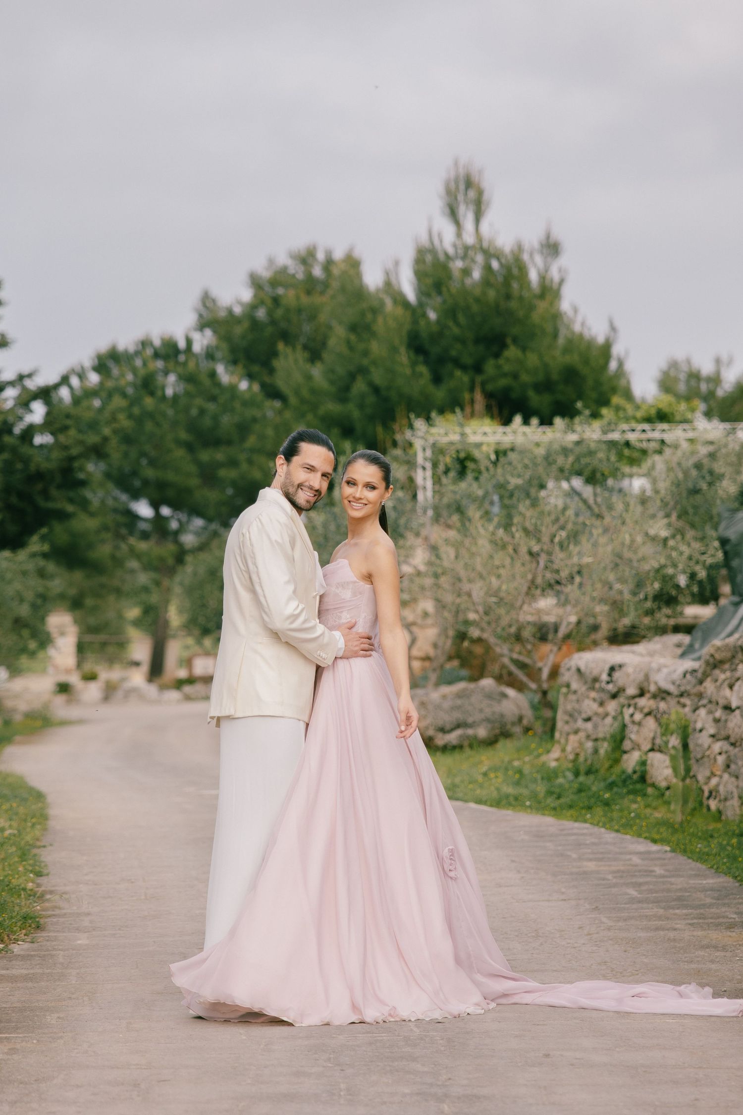 Destination wedding couple enjoying sunset on an Italian terrace