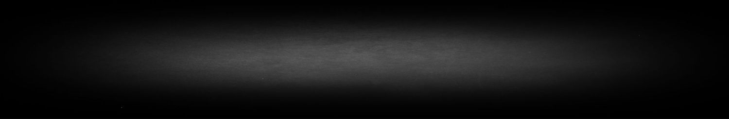 A dark blurred horizontal line against a black background.