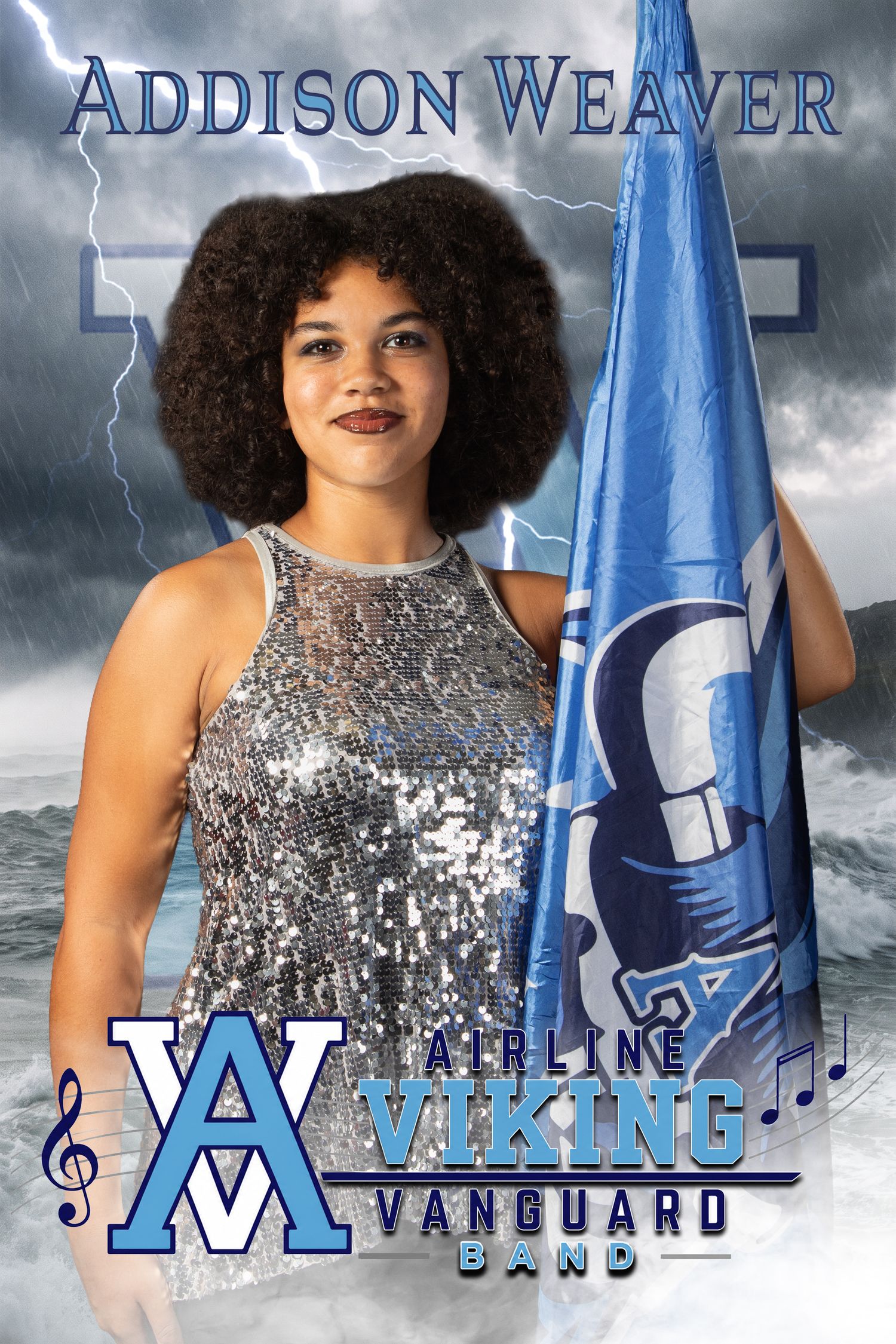 Addison Weaver poses with a blue flag for the Airline Viking Vanguard Band portrait against a stormy background.