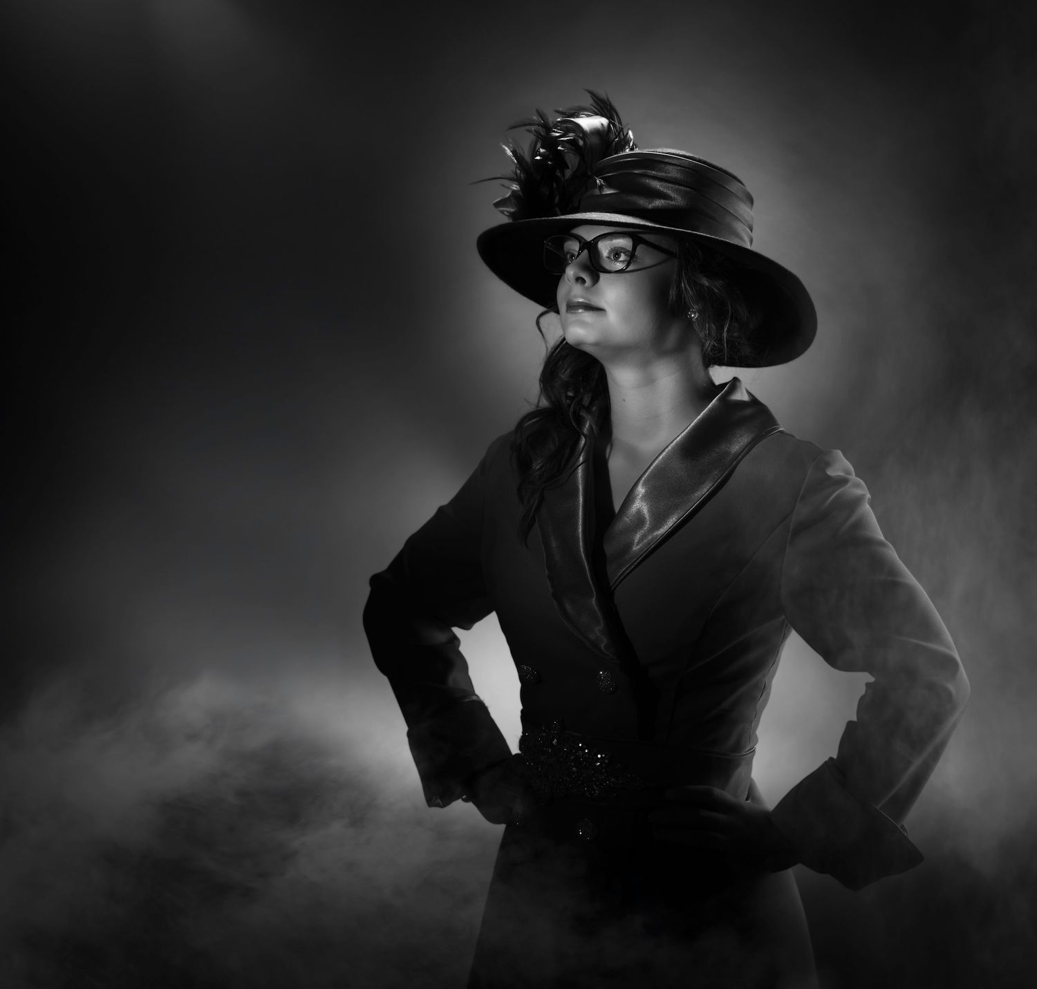 Dramatic black and white portrait series showing mysterious figure in hat and coat emerging from shadows.