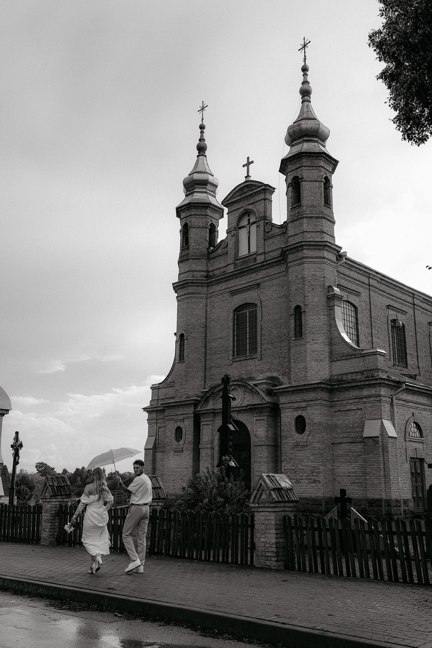 A sequence of five black and white photos showing a historic church building with ornate spires and architectural details.