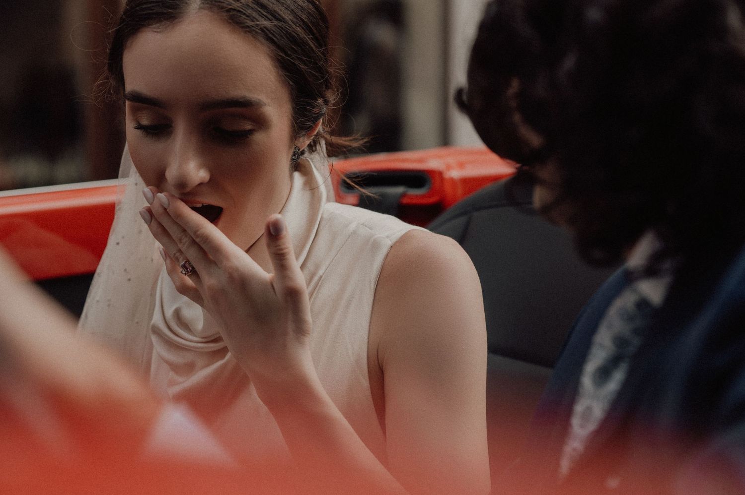 Close-up shots of a bride in an elegant white dress showing various emotional moments.