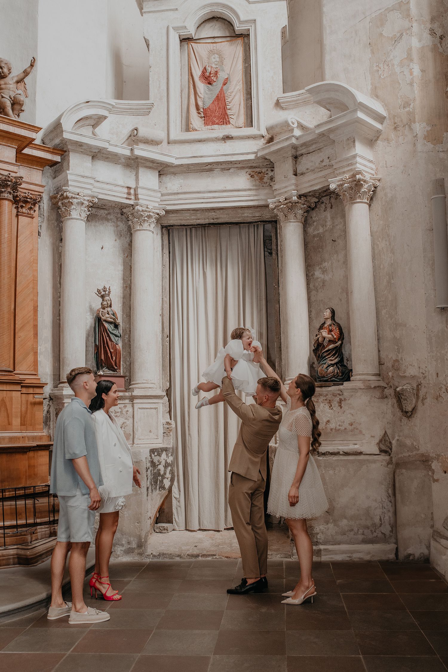 A series of five photos showing people posing playfully in front of ornate church walls and columns.