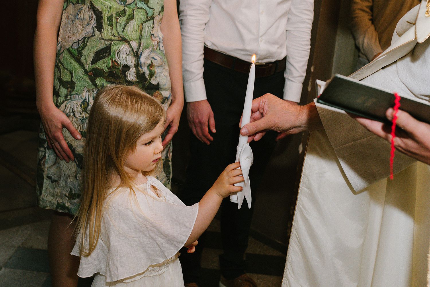 A row of candid moments at a wedding ceremony showing hands, formal attire, and floral details.